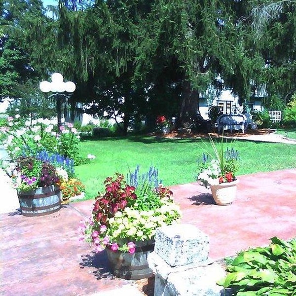 The gardens at the Historic Scanlan House Bed and Breakfast are meticulously maintained, offering a serene and picturesque setting for guests to enjoy. 