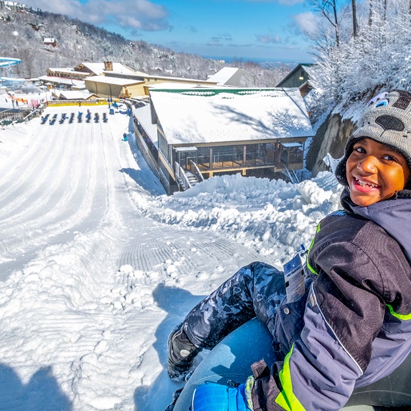 Ober Gatlinburg offers snow tubing, a popular winter activity for visitors of all ages, which is serviced by a magic carpet lift, allowing for easy access to the top of the hill. 