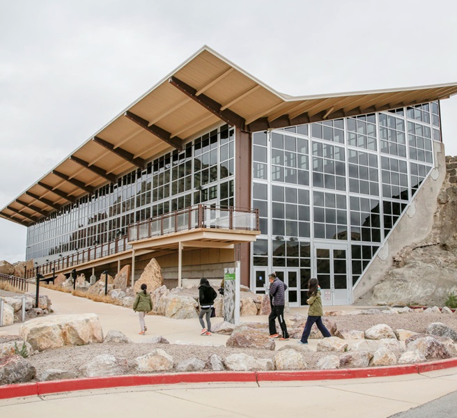 The Quarry Exhibit Hall provides an indoor view of the fossil wall, along with interactive exhibits and displays about the dinosaurs and the history of the site. 